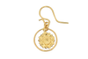 Gold earring with a circular design on a white background